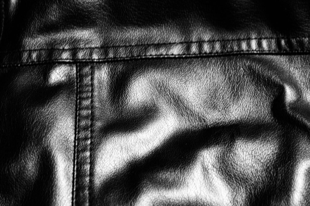 Close-up of black leather with stitching detail